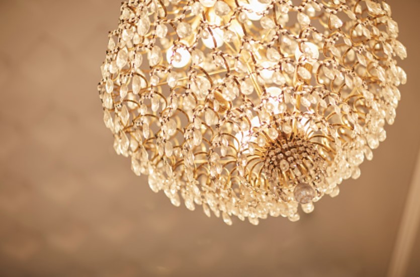 beautiful Crystal Chandelier hanging on wall