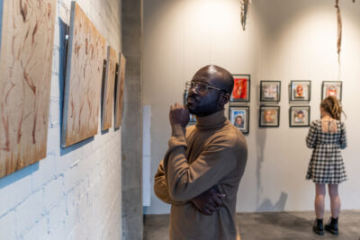 Serious African man in brown pullover