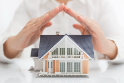 Man looking on Miniature house
