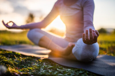 Close up of meditation in park at sunrise
